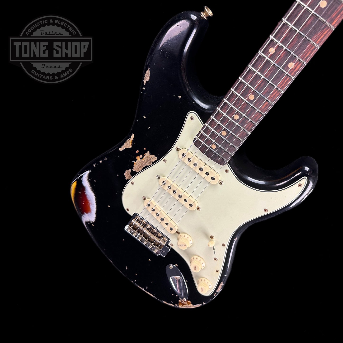 Front angle of Fender Custom Shop 2023 Collection 60 Strat Heavy Relic Aged Black Over 3 Color Sunburst.