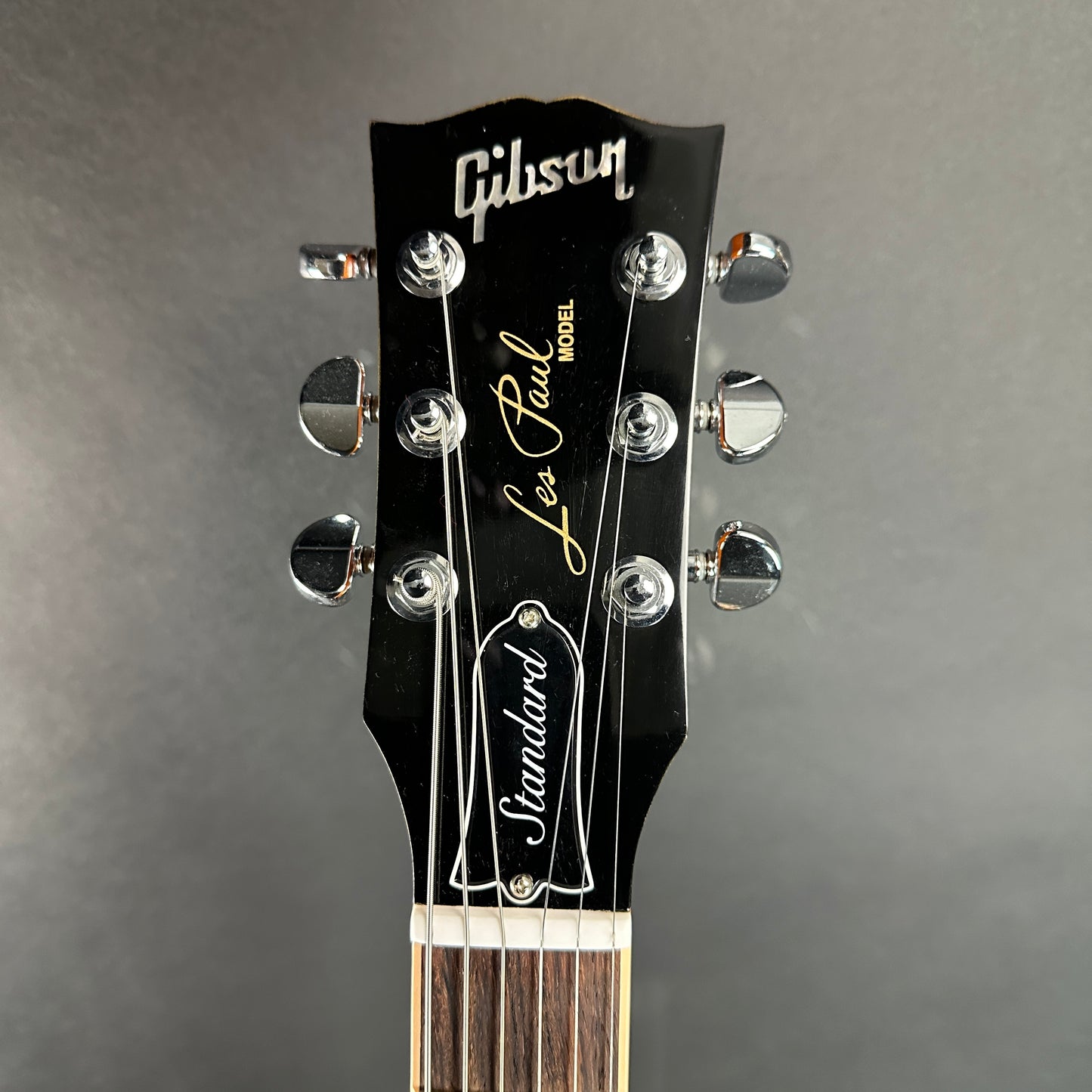 Front of headstock of Used 2012 Gibson Les Paul Standard Flamed Amber.