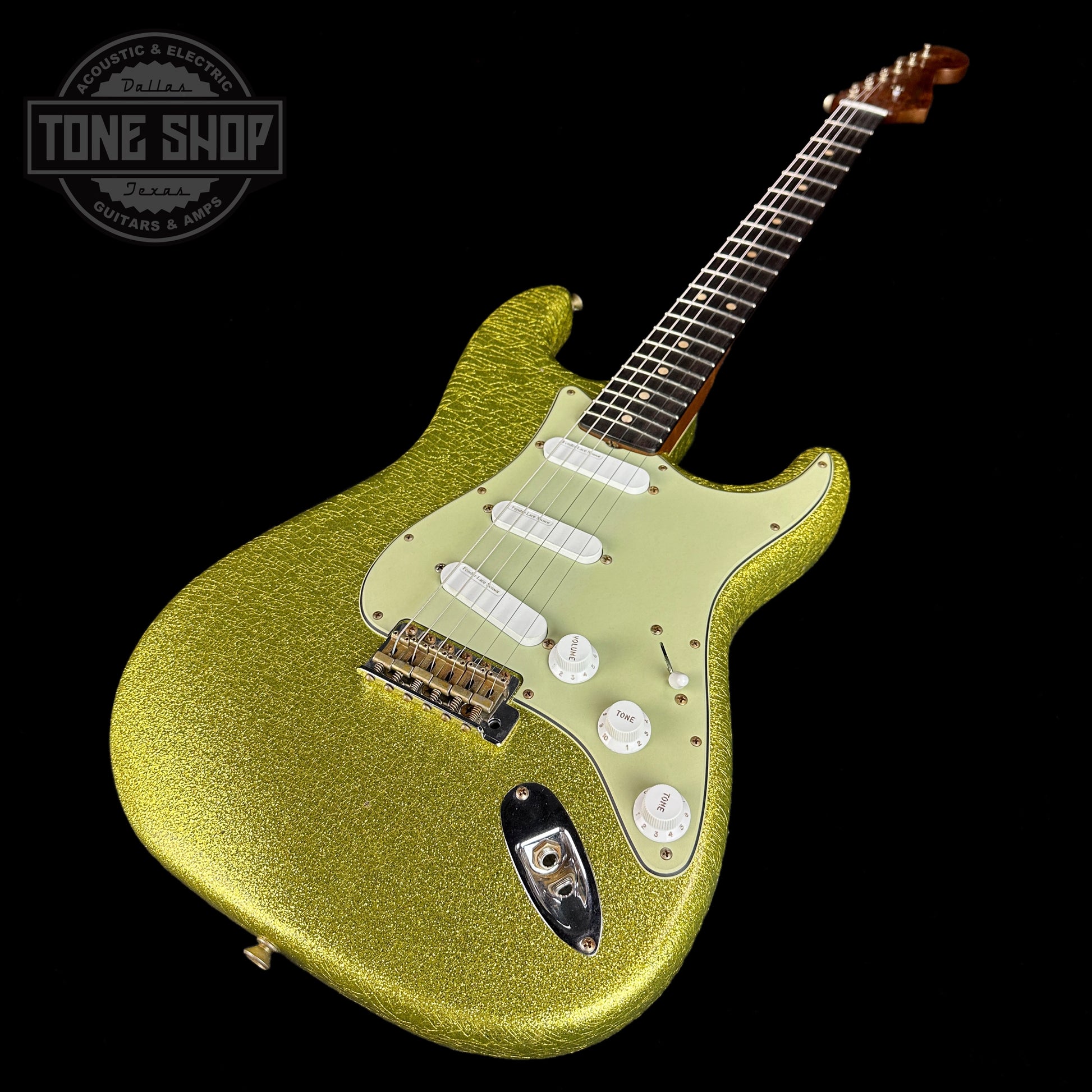 Front angle of Fender Custom Shop 1964 Stratocaster Journeyman Relic Chartreuse Sparkle.