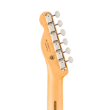 Close-up of the headstock of a Fender Stratocaster electric guitar in natural maple wood, featuring six silver tuning pegs with white knobs and the Fender logo printed on the back.