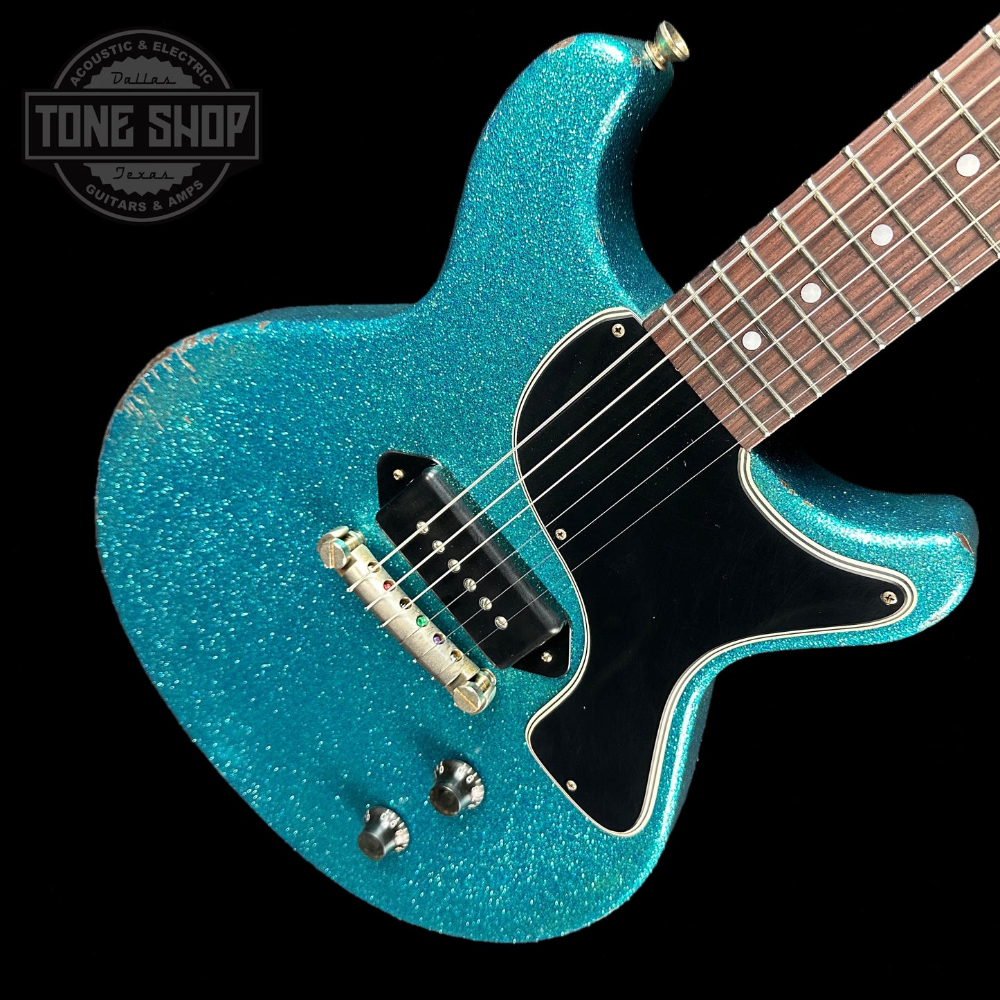Front angle of Rock N Roll Relics Thunders Teal Sparkle Med Aging.