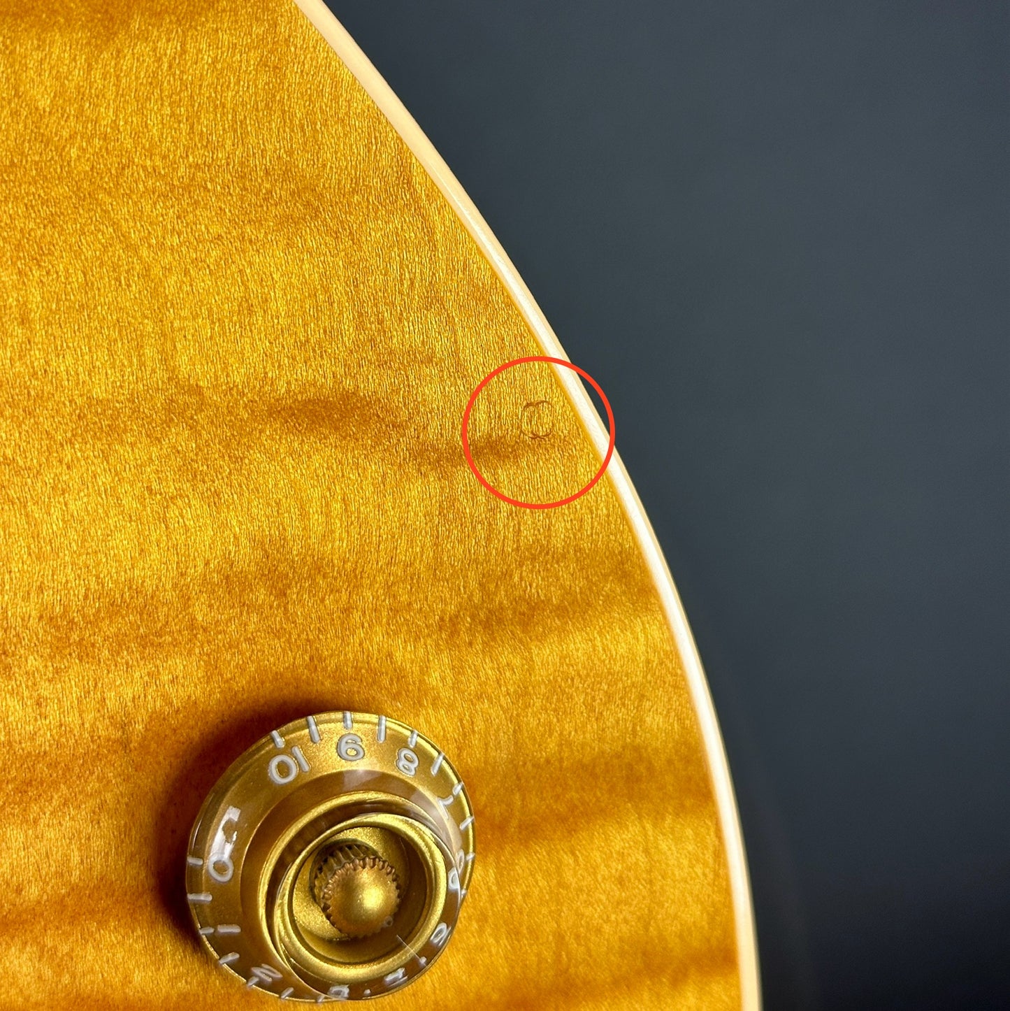 Ding near controls of Used 2005 Gibson Les Paul Standard Lemonburst.