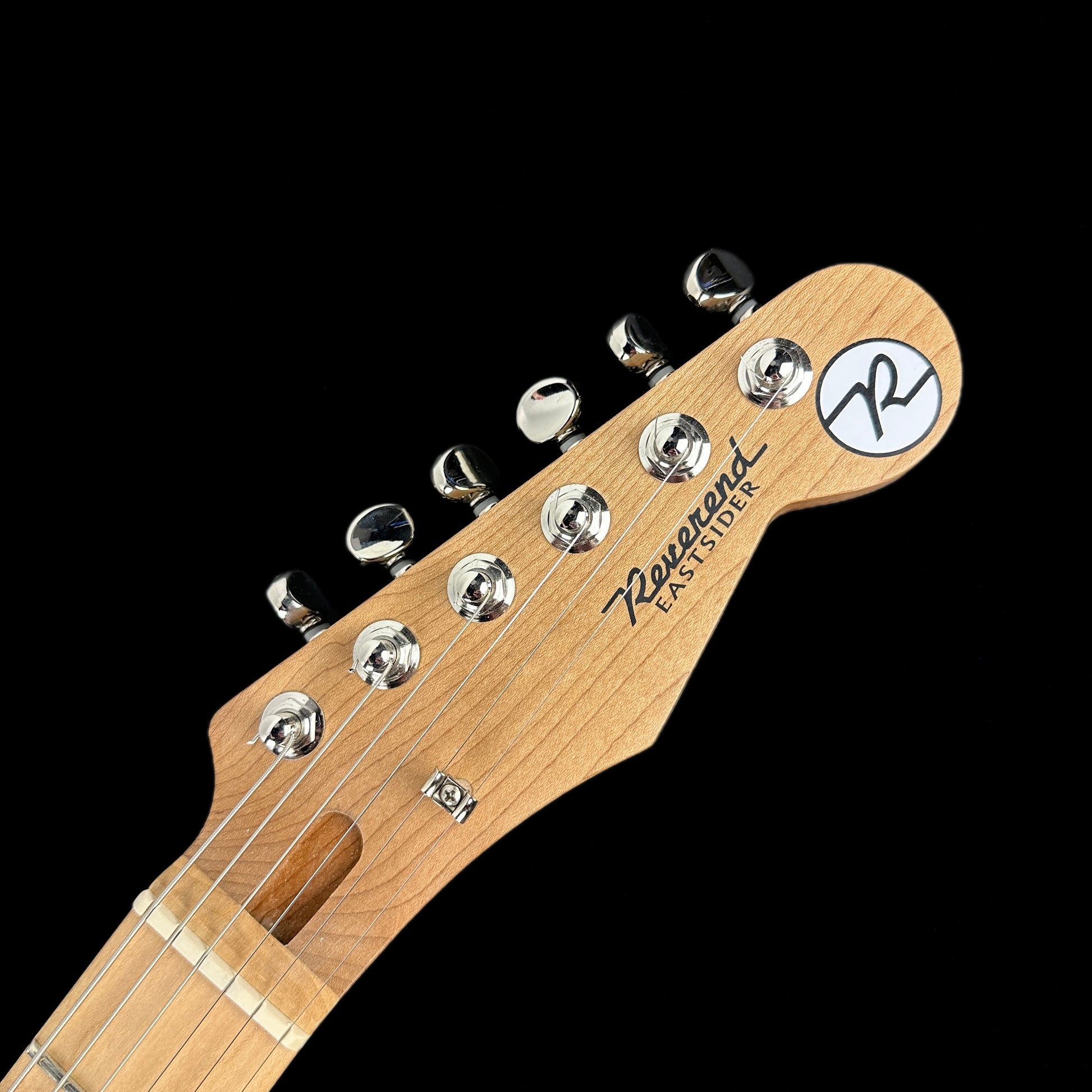 Front of headstock of Reverend Eastsider T "E" Gloss Pete Anderson Silver Sparkle Tone Shop Exclusive.
