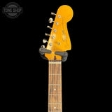 Squier Classic Vibe 60s Jazzmaster Oly White headstock with tuning pegs on a black background, featuring the 'Tone Shop' logo.