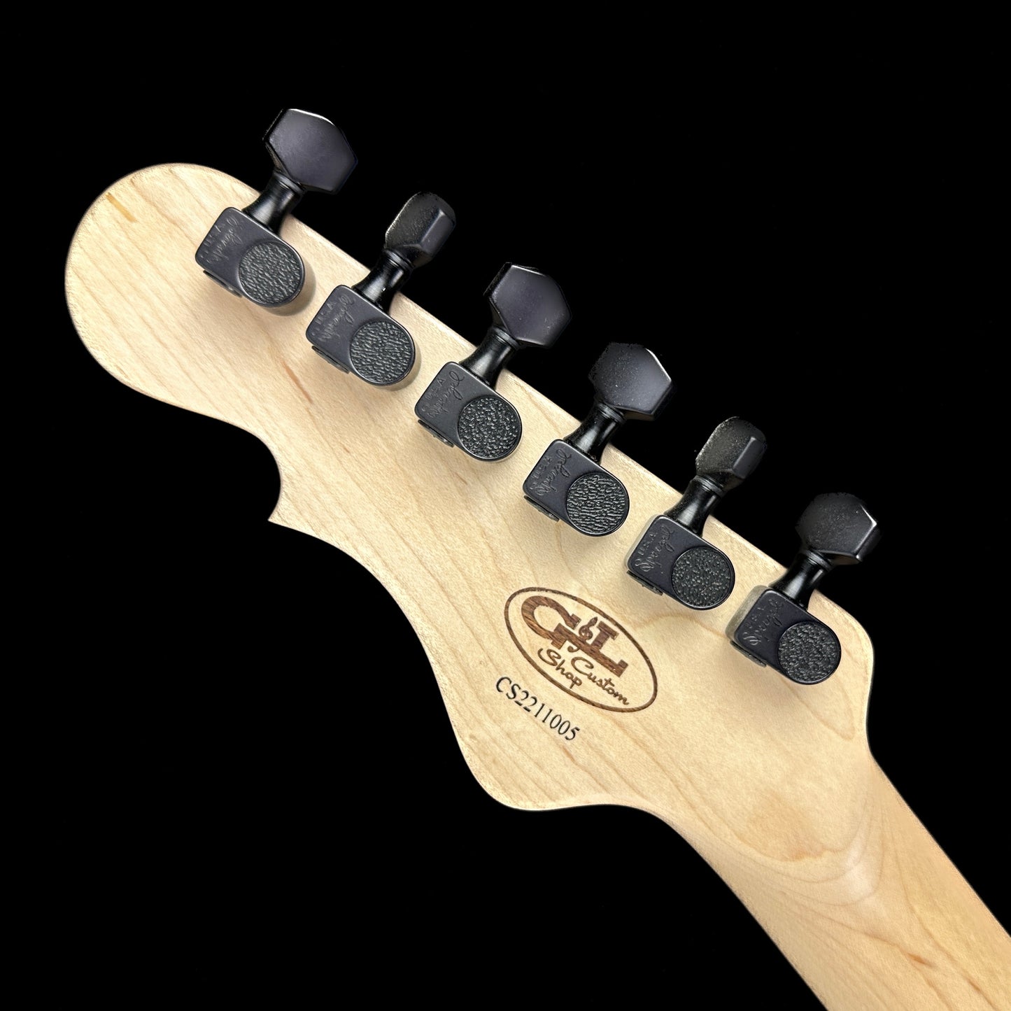 Back of headstock of G&L Custom Shop Rampage Margarita Metallic Frost Black Painted Headstock.