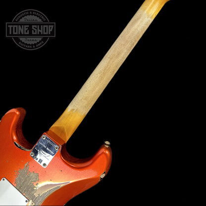 Back of neck of Fender Custom Shop Limited Edition 62 Strat Heavy Relic Aged Candy Tangerine Over 3 Color Sunburst.