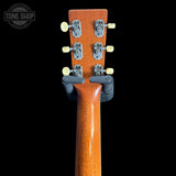 Martin Custom Shop 00L-14 All-Mahogany Close-up of a guitar headstock with tuning pegs on a black background, featuring the Tone Shop logo.