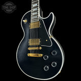 Front right angle of Gibson Custom Dealer Select Les Paul Custom Ebony Ultra Light Aged CS502621.