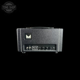 A black Marshall ML12 guitar amplifier head against a solid black background, featuring a textured exterior, a front control panel with knobs, and the Marshall logo.