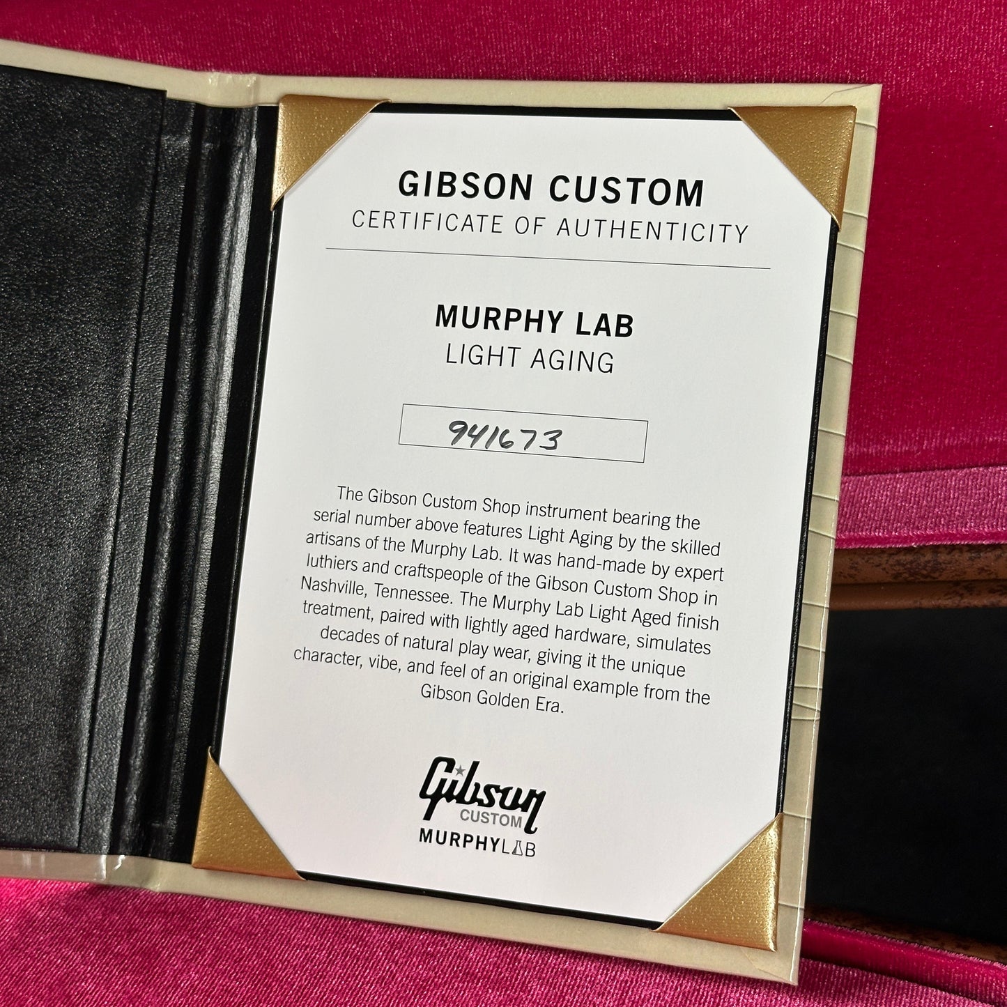 Gibson Custom Certificate of Authenticity for a guitar on a pink background