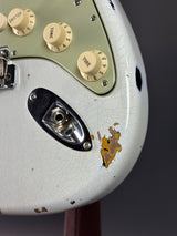 Close-up of a vintage guitar amplifier with visible wear and rust.