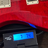 Used PRS S2 Custom Scarlet Red on scale displaying weight.
