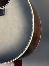 Close-up of an acoustic guitar's soundhole and body