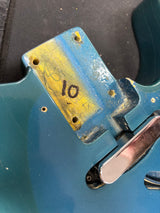 Blue metal bracket with yellow label and number 10 on a black background