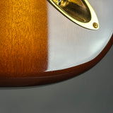 Ding on body of Used 2015 Fender Custom Shop Artisan Okoume Strat.