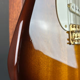 Ding on body of Used 2015 Fender Custom Shop Artisan Okoume Strat.