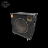 A vintage black guitar speaker cabinet with a front mesh grille, a large woofer, and a small gold tweeter, shown on a black background with a Tone Shop watermark in the top left.