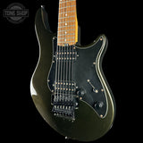 A dark metallic olive green electric guitar with a black pickguard and maple neck, shown against a solid black background with a Tone Shop watermark in the top left corner.