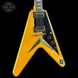 Yellow electric guitar with a black pickguard on a white background, featuring 'Tone Shop' branding.