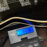 Used Silvertone 1423 Jupiter Reissue on scale displaying weight.