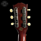 Gibson guitar headstock with brand logo on a black background