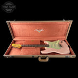 Pink electric guitar in a Fender case with 'Tone Shop' logo.