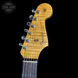 Fender guitar headstock on a black background with 'Tone Shop' logo.