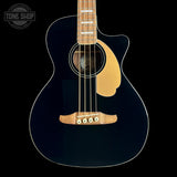 A dark navy blue acoustic guitar with a natural wood body, soundhole surround, and bridge, shown against a solid black background. A Tone Shop watermark is visible in the top-left corner.