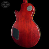 The back of an electric guitar with a glossy red cherry finish, featuring a silver 'Moser' brand plate and a black pickguard, shown against a solid black background.