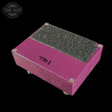 A pink metal foot pedal with a textured gray suede or fabric-covered top surface, featuring the handwritten number '7701' on the side. The pedal is shown at an angle on a solid black background with a Tone Shop watermark in the upper left corner.