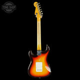 Electric guitar with a sunburst finish on a black background, featuring the Tone Shop logo.