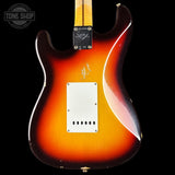 Guitar body with a sunburst finish on a black background, featuring the Tone Shop logo.
