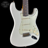White electric guitar with a 'Tone Shop' logo in the corner