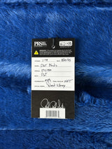 Close-up of a label on blue textured fabric