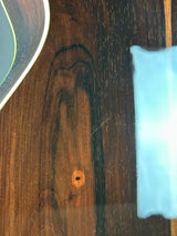 Wooden surface with a blue sponge and white cloth on top