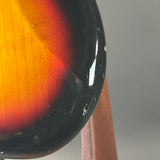 Wear on bottom edge of Used 2016 Squier Classic Vibe 60's Stratocaster Sunburst.