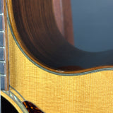 Close-up of a guitar's wooden neck and fretboard