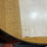 Close-up of a woven basket with a white fabric background