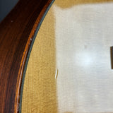 Close-up of a textured surface with a wooden frame on the left