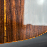 Close-up of a wooden surface with a reflective metal strip