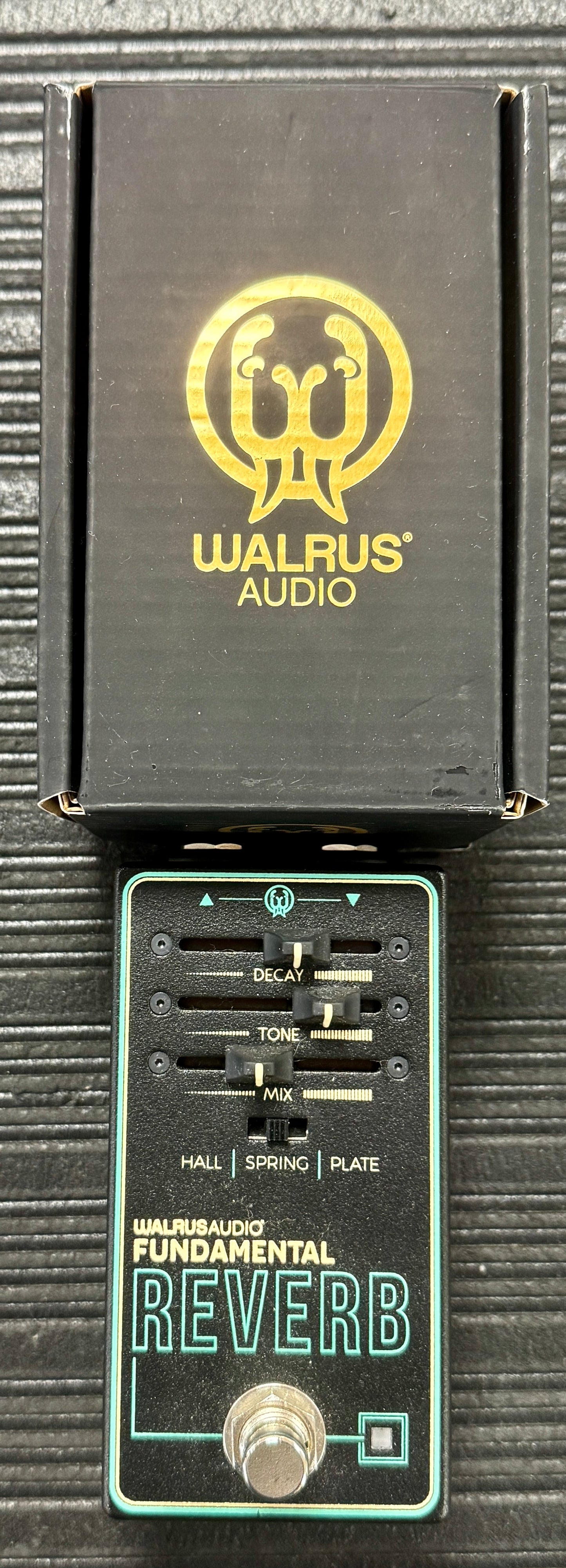 Walrus Audio Fundamental Reverb guitar effects pedal on a textured surface