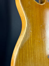 Close-up of a wooden surface with a dark background