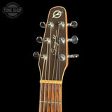 Close-up of a guitar headstock with six tuning pegs, a dark brown wood finish, and the 'Seagull' brand name and logo printed on it, set against a solid black background.