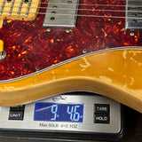 Guitar on a digital scale displaying weight