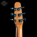 Close-up of the headstock of a guitar, showing six black tuning pegs on a natural wood neck against a solid black background. A 'TONE SHOP' watermark is visible in the top left corner.