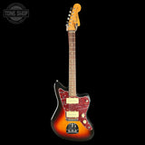 A classic electric guitar with a sunburst finish, featuring a red marbled pickguard, cream-colored hardware, and a maple headstock, shown against a solid black background.