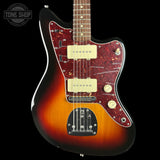 A classic electric guitar with a sunburst finish, featuring a dark red marbled pickguard and cream-colored humbucker pickups, shown against a solid black background.