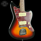 A classic electric guitar with a sunburst finish, featuring a red maple body, a dark red pickguard, cream humbucker pickups, and a black headstock, shown against a black background with a Tone Shop watermark in the top left corner.