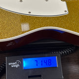 Used Reverend Eastsider T TSG Gold Sparkle on scale displaying weight.