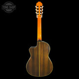 The back view of a classical acoustic guitar with a glossy orange neck and a dark brown wooden body, shown against a solid black background with a Tone Shop watermark in the top left corner.